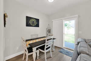 Dining area featuring light wood finished floors and baseboards