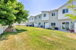 Rear view of property featuring a patio area