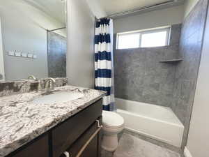 Upstairs Full bath featuring vanity and shower / bathtub combination with curtain