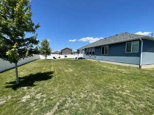 View of fenced backyard