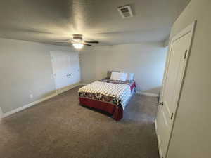 Bedroom #3 with carpet floors, a textured ceiling, and a ceiling fan