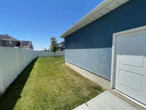 View of fenced backyard