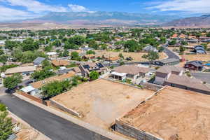 Aerial perspective of suburban area featuring a mountain backdrop
