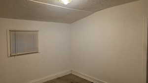Empty room with baseboards and carpet floors