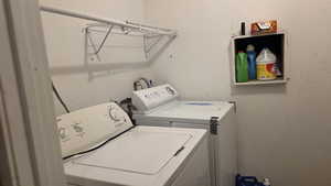 Washroom with washing machine and clothes dryer
