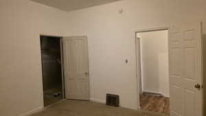 Unfurnished bedroom with carpet