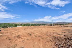 View of mountain backdrop featuring rural landscape