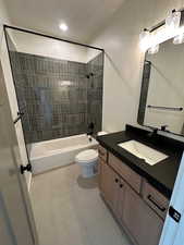 Full bathroom with bathtub / shower combination, vanity, recessed lighting, and tile patterned floors
