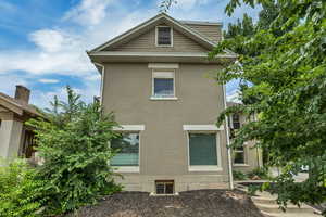 View of side of property featuring brick siding