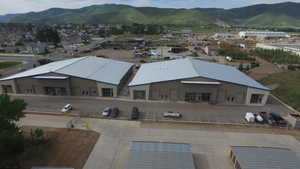 Aerial view of property and surrounding area with mountains
