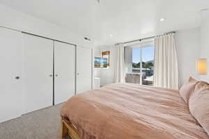 Bedroom featuring carpet, a closet, access to exterior, and recessed lighting