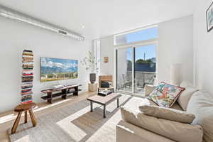Living area featuring wood finished floors and recessed lighting