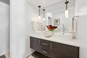 Full bathroom with double vanity and tile patterned floors
