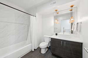 Full bath featuring vanity and shower / tub combo with curtain