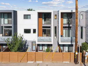 View of property featuring a fenced front yard
