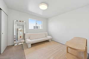 Living area with carpet flooring and baseboards