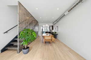 Dining room featuring wood finished floors and recessed lighting