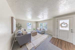 Living room gets lots of natural light - built in blinds will keep that sunlight out when needed.