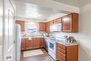 Kitchen features granite countertops and LVP flooring. Scratch proof, dent proof, water proof!
