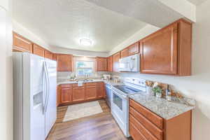 The open tri-level design flows from the living room up to the kitchen and dining area.