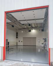 Garage featuring a garage door opener
