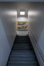 Stairway featuring baseboards