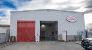 View of property with a garage