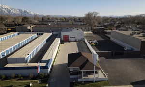 Aerial view of residential area featuring a mountainous background