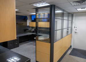 Kitchen featuring a drop ceiling and an office area