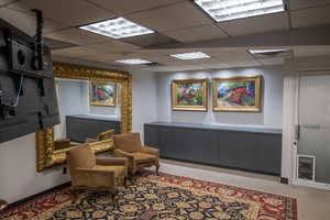 Sitting room with a drop ceiling