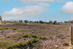 View of yard with a view of countryside and a mountain view