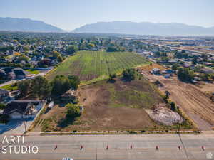 Aerial view of property's location with a mountainous background and rural landscape