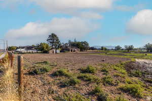View of yard with a rural view