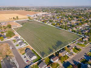 Aerial view of residential area featuring property boundaries highlighted