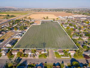 Aerial view of sparsely populated area featuring property boundaries highlighted and abundant farmland