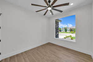 Spare room with light wood-style floors, recessed lighting, and a ceiling fan