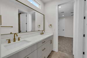 Bathroom featuring double vanity and recessed lighting