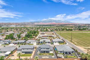 Aerial perspective of suburban area with a mountain backdrop