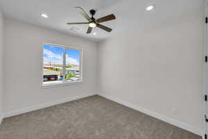 Unfurnished room with ceiling fan, recessed lighting, and carpet flooring