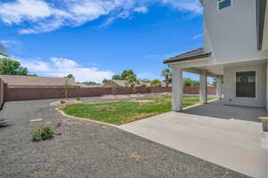 Fenced backyard featuring a patio area