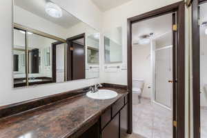 Bathroom featuring a stall shower and vanity