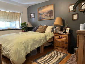 Bedroom featuring wood finished floors