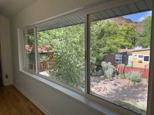 Unfurnished sunroom featuring plenty of natural light
