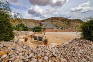 View of yard with a patio and a mountain view