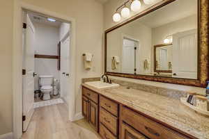 Bathroom featuring wood finished floors and vanity