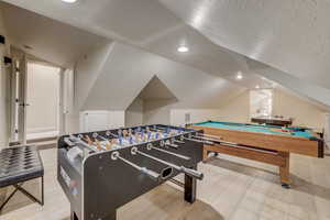 Playroom with lofted ceiling, wood finished floors, billiards table, and recessed lighting