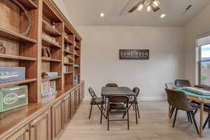 Dining room with a ceiling fan, a desk, light wood-type flooring, and recessed lighting