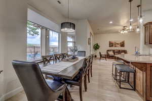 Dining space featuring recessed lighting, light wood finished floors, and a chandelier
