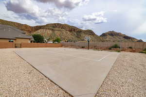 View of patio / terrace featuring a mountain view and community basketball court
