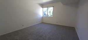 Spare room with carpet floors and baseboards